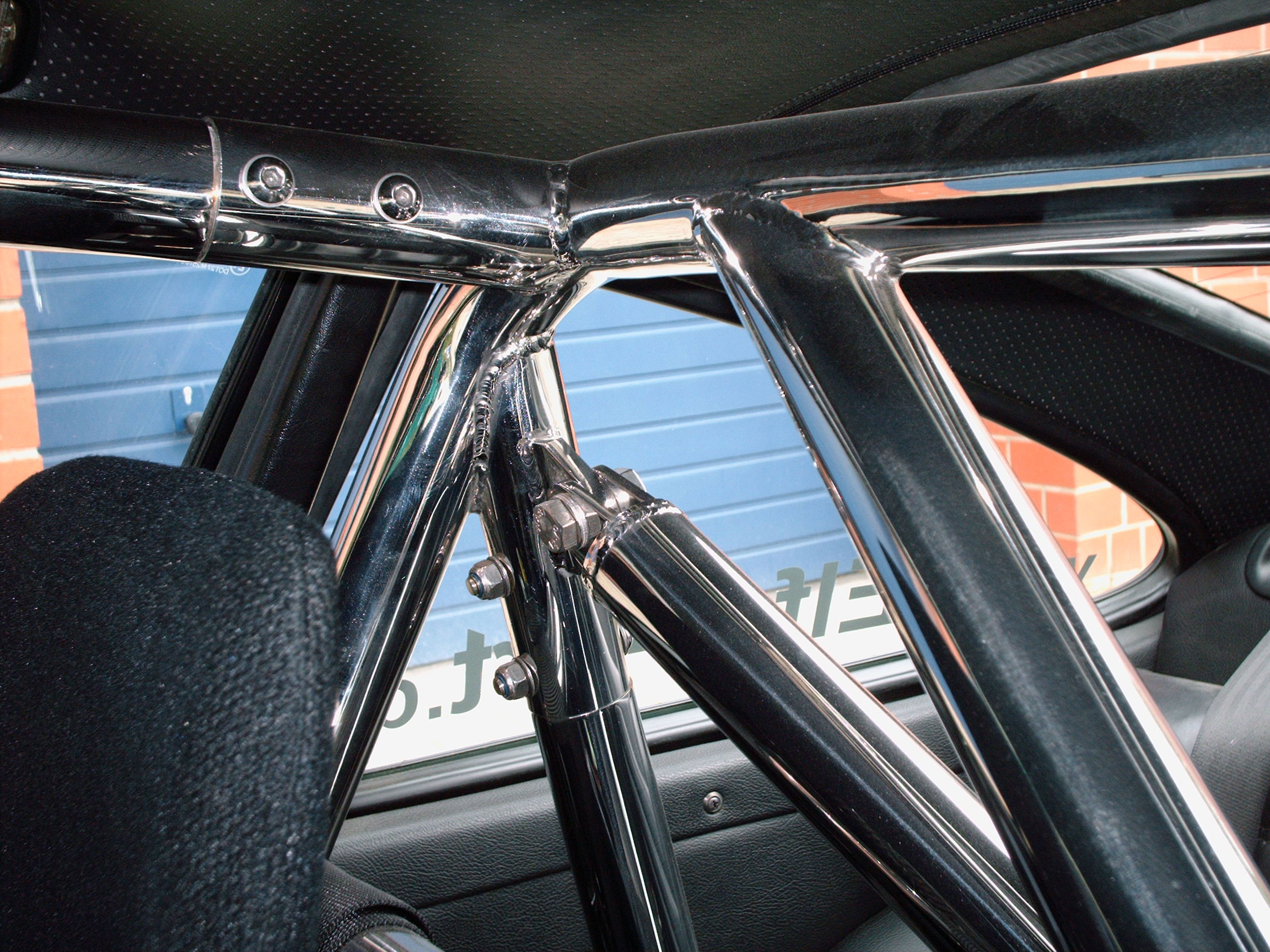 Überroll-Käfig passend für Porsche 964, inkl. Diagonal-Kreuz 3-teilig, inkl. eingeschweißtem und gebogenem Grutrohr, inkl. Diagonale durch das Gurtrohr, Oberfläche Edelstahl HOCHGLANZ poliert